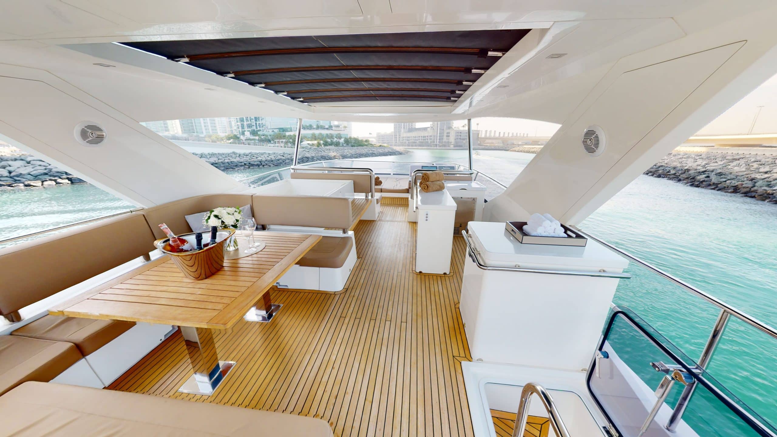 Galeon 780 F1 luxury yacht flybridge dining and entertainment area with panoramic sea view