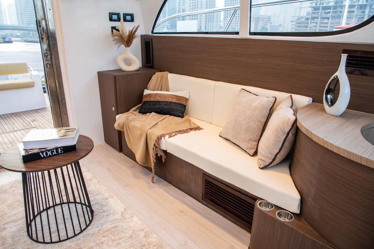 Elan 44 cabin seating area with cushioned sofa and wooden design
