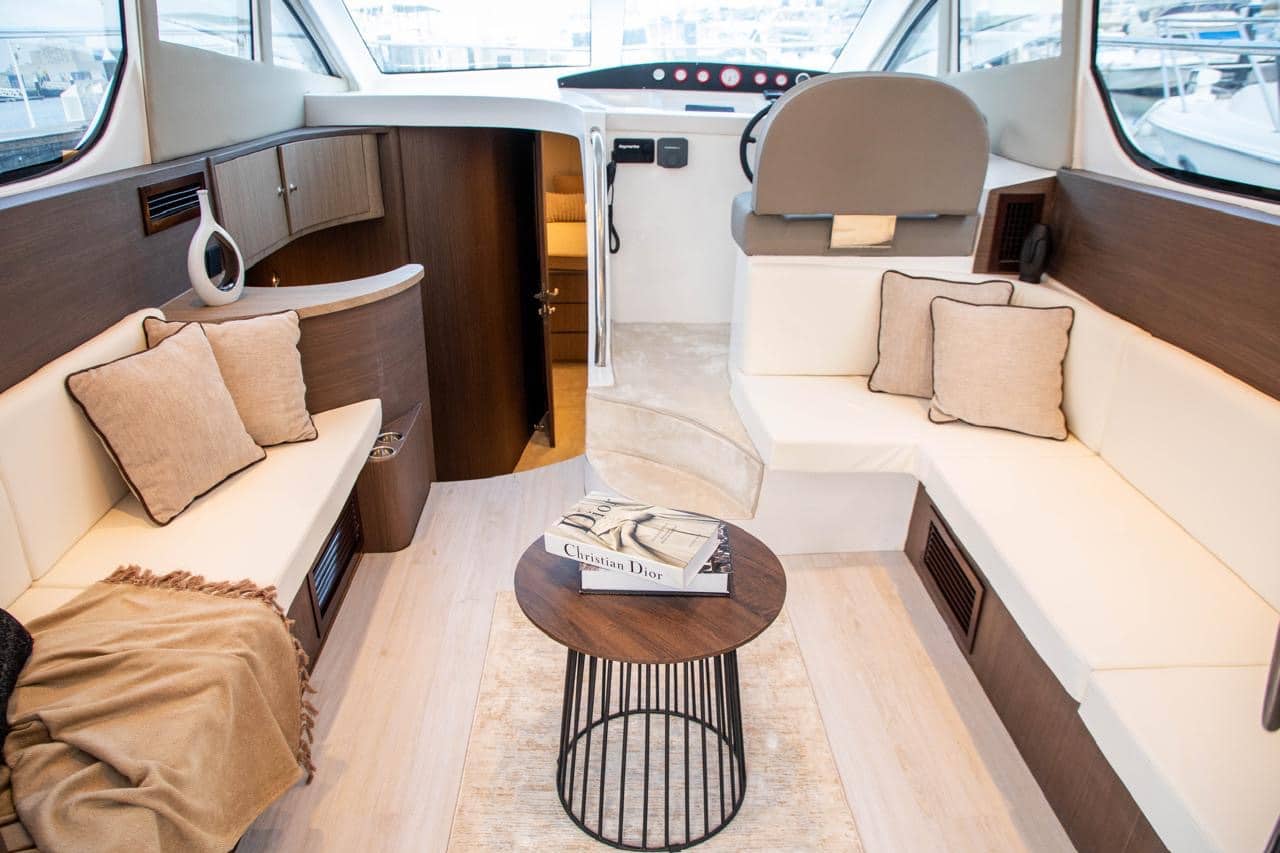 Elan 44 main salon interior with sofa seating and wooden finishes