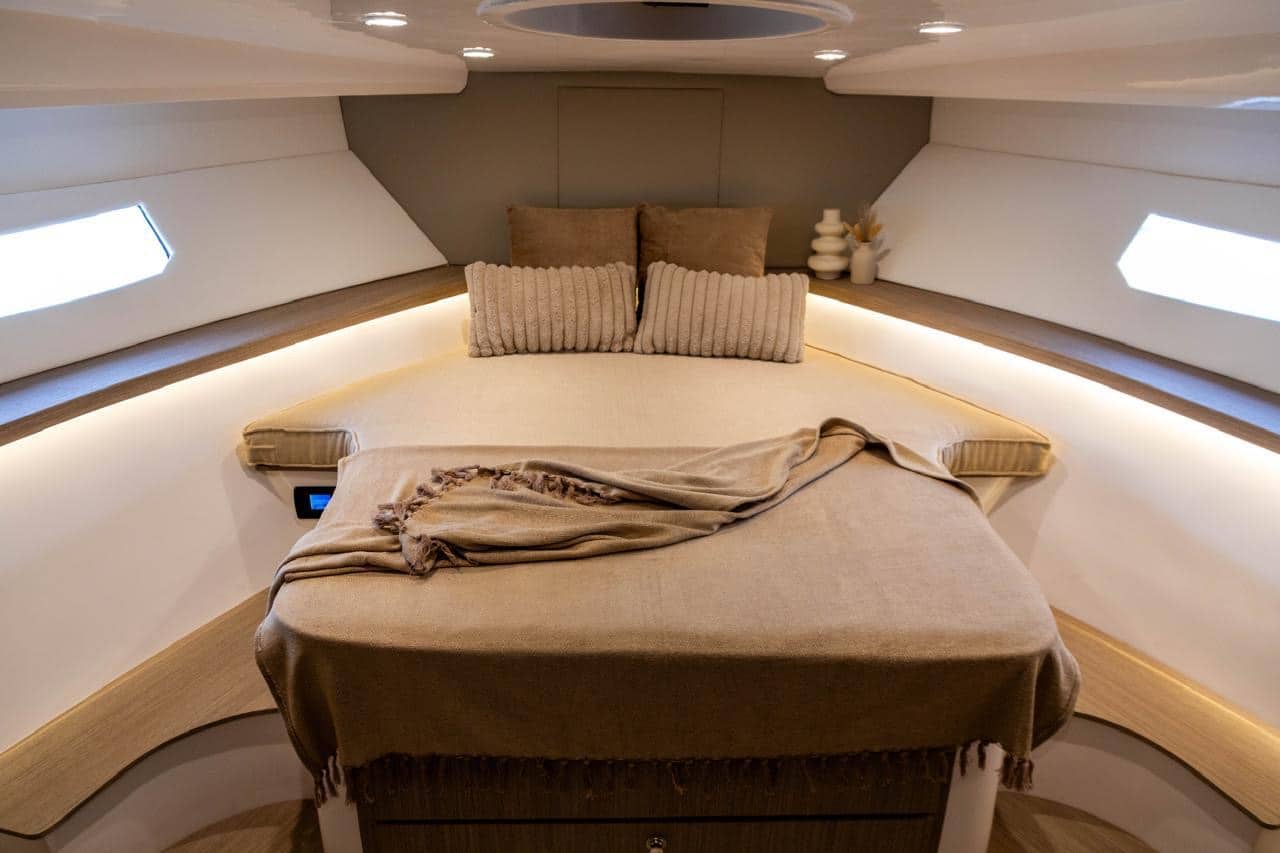 Elan 44 master cabin with double bed and soft interior lighting