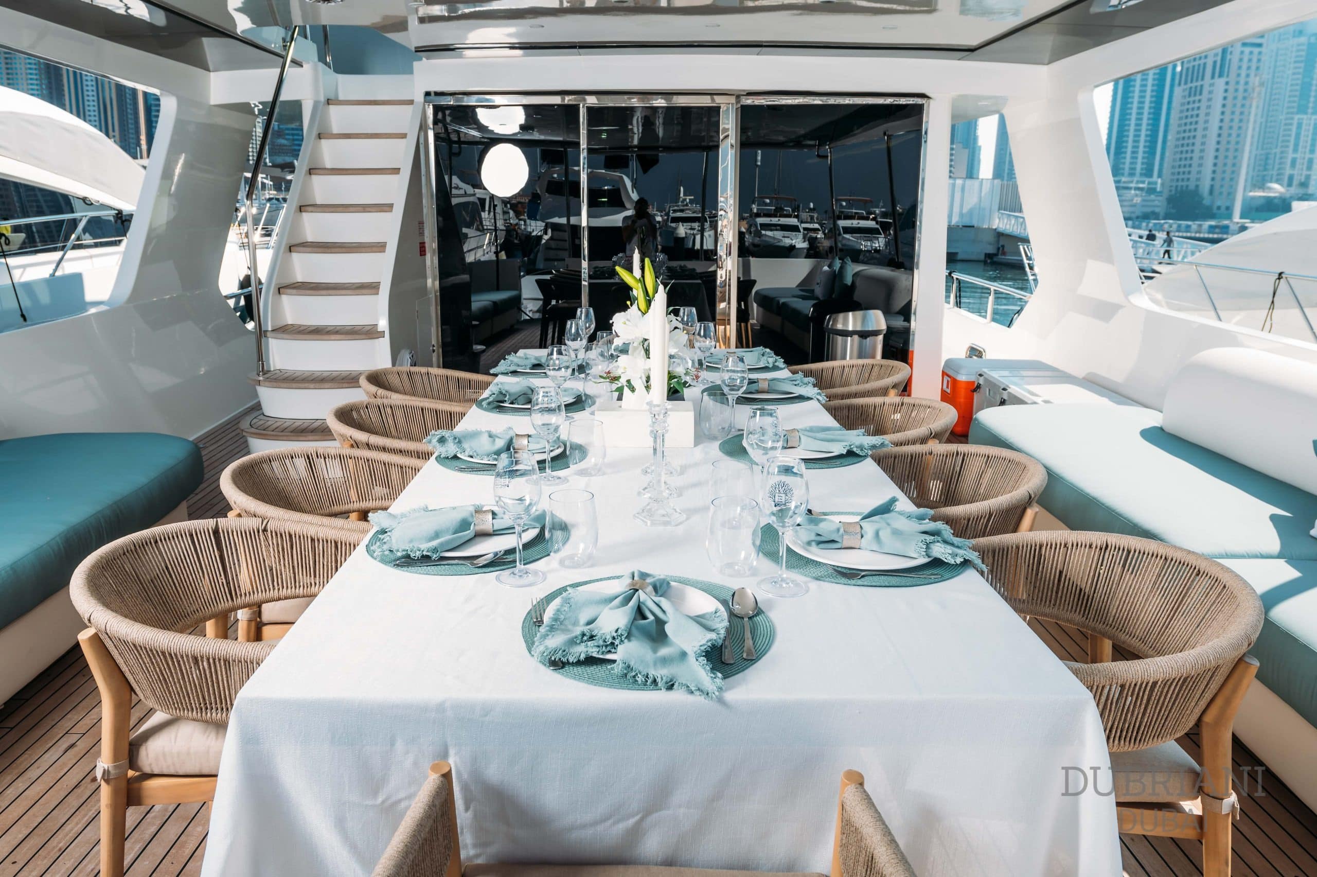 Elegant formal dining table setup aboard Eclipse yacht with luxury place settings and panoramic windows+