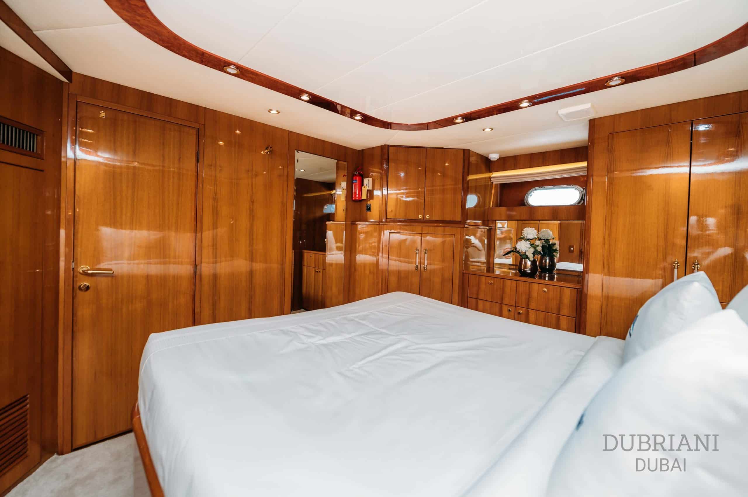 Master suite bedroom on Eclipse superyacht with spacious bed and elegant interior design