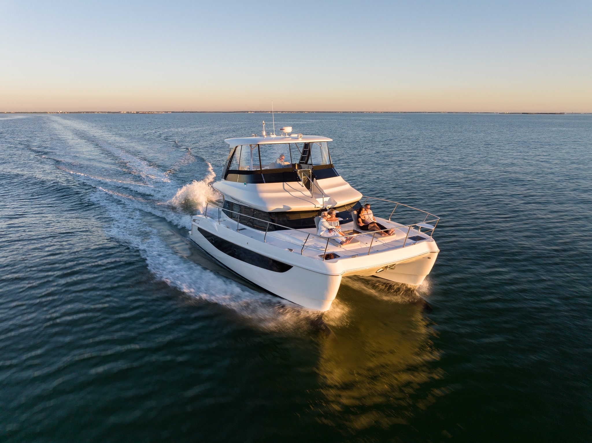 Aquila 42 aerial stern view running on open water, shipyard photo