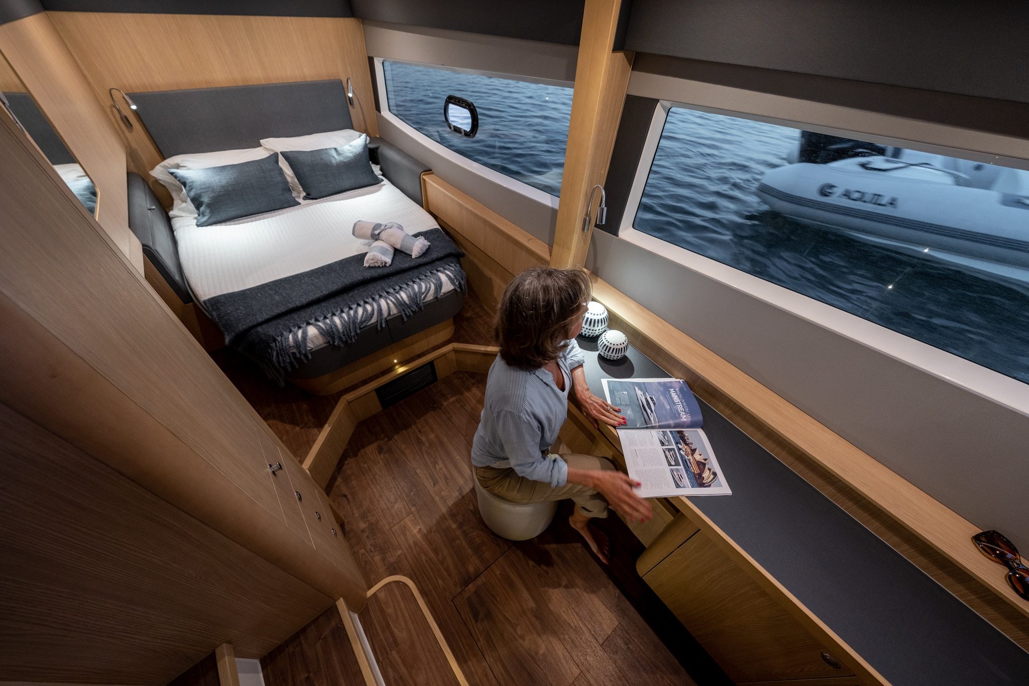 Aquila 42 cabin with sea view through hull window, shipyard photo