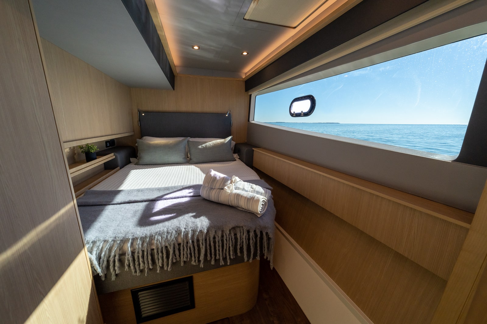 Aquila 42 guest double cabin with hull window, shipyard photo