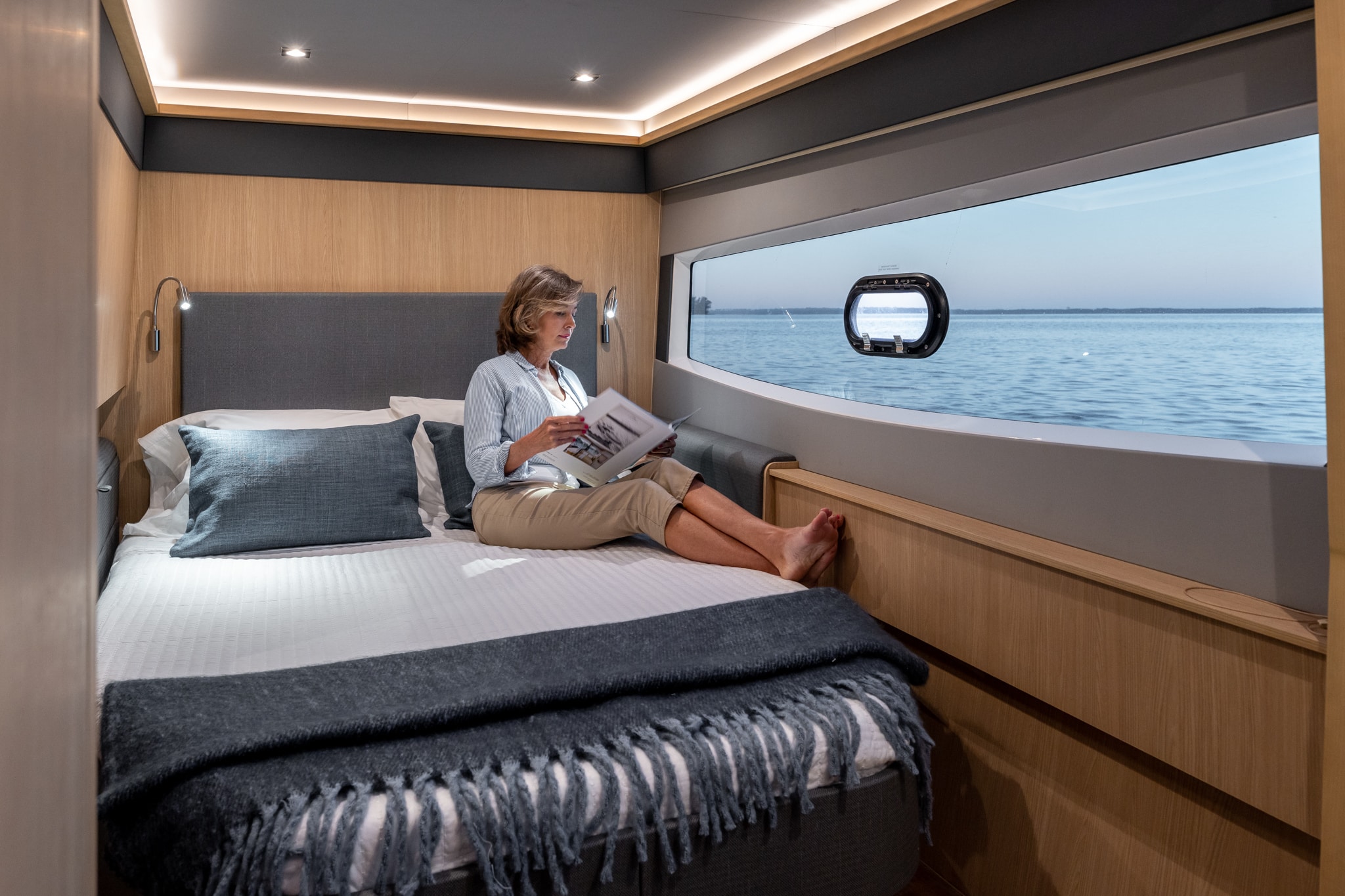 Aquila 42 master cabin with panoramic hull window, shipyard photo