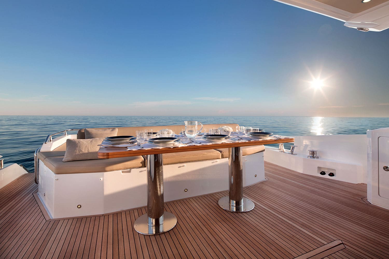 Azimut 77S cockpit dining table set at sunset — shipyard photo