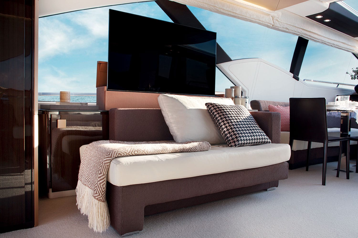 Azimut 77S saloon sofa with television raised — shipyard photo