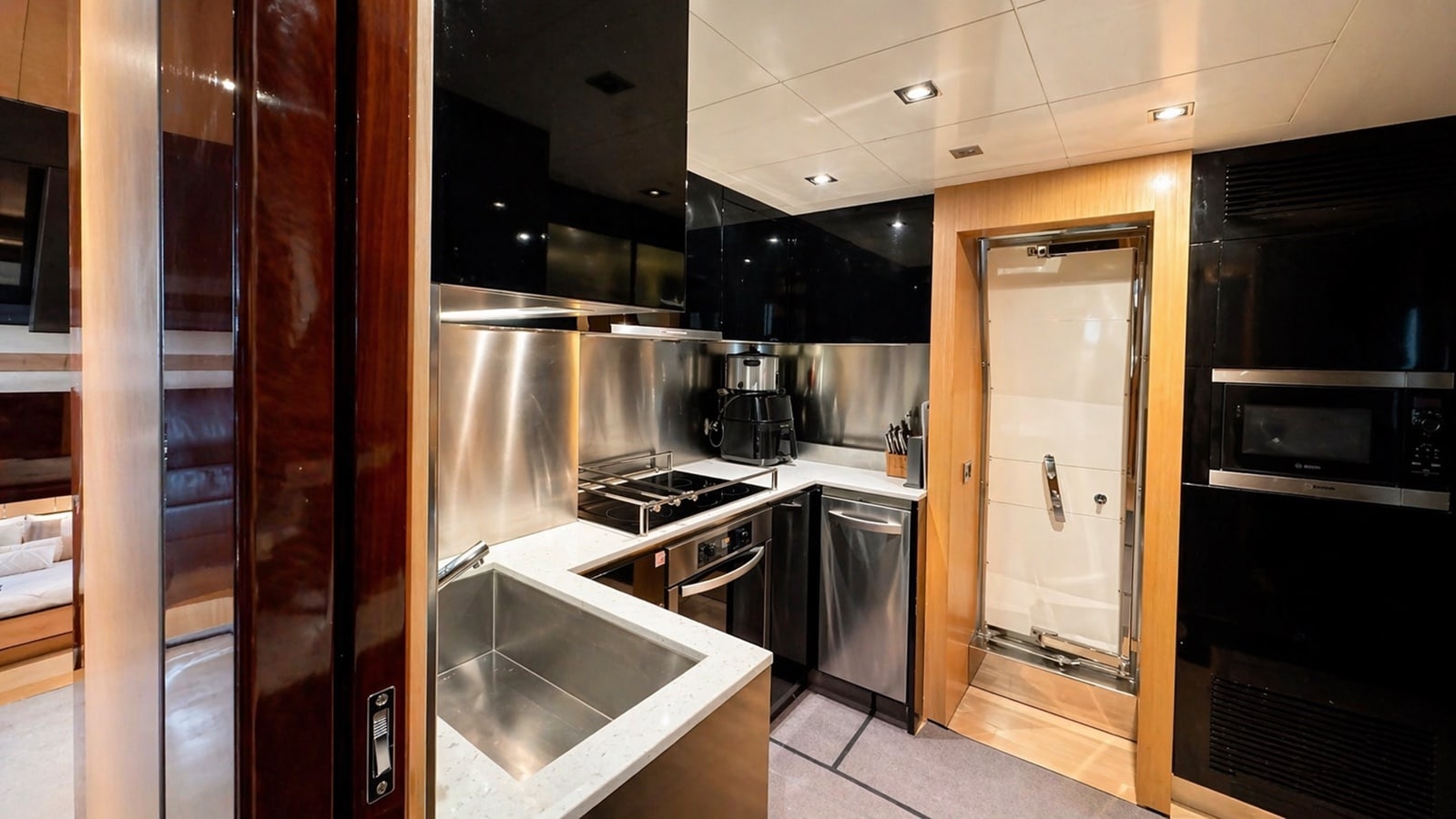 Azimut 88 galley with stainless steel appliances and hob
