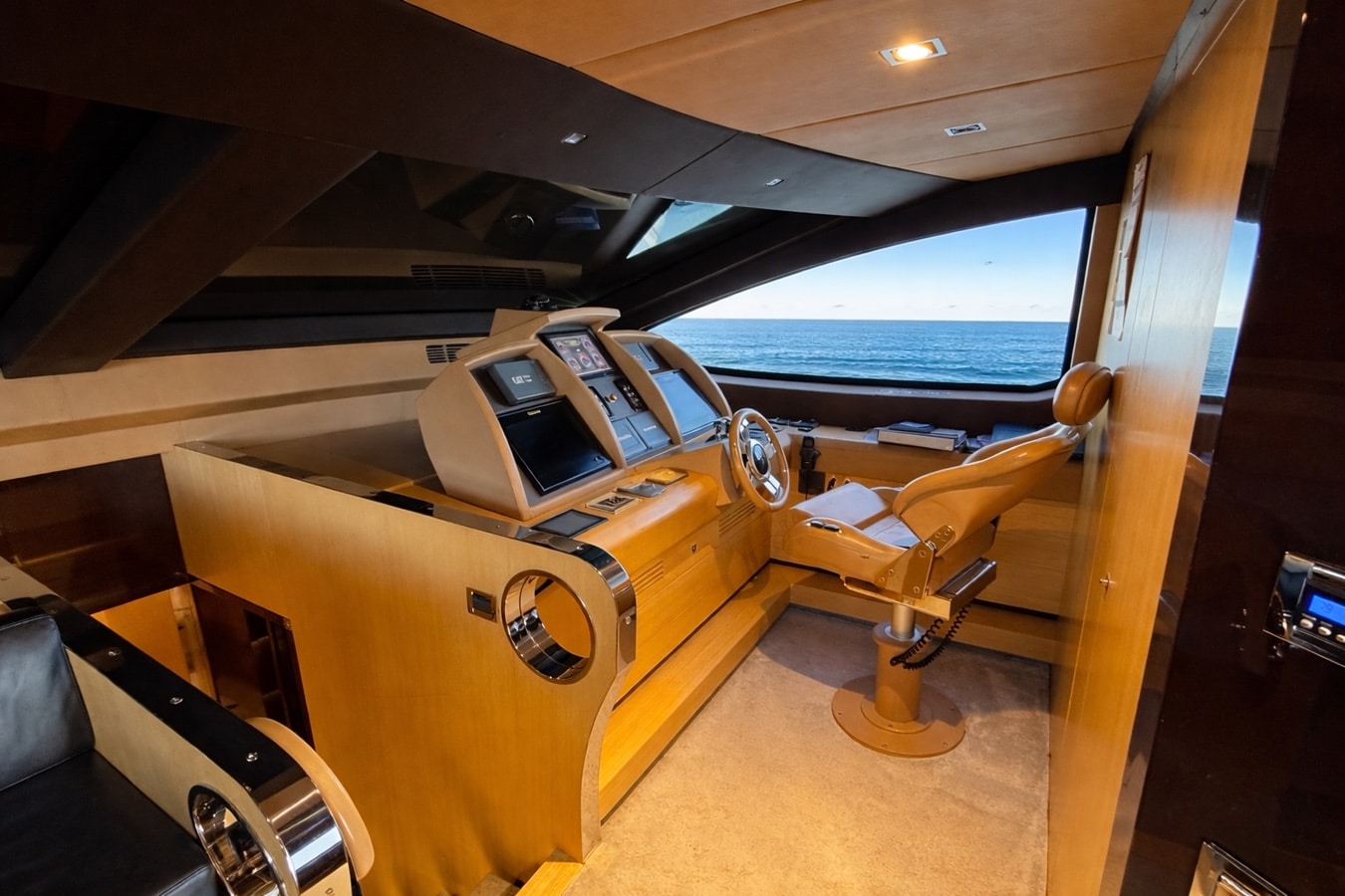 Azimut 88 lower helm station with triple navigation displays
