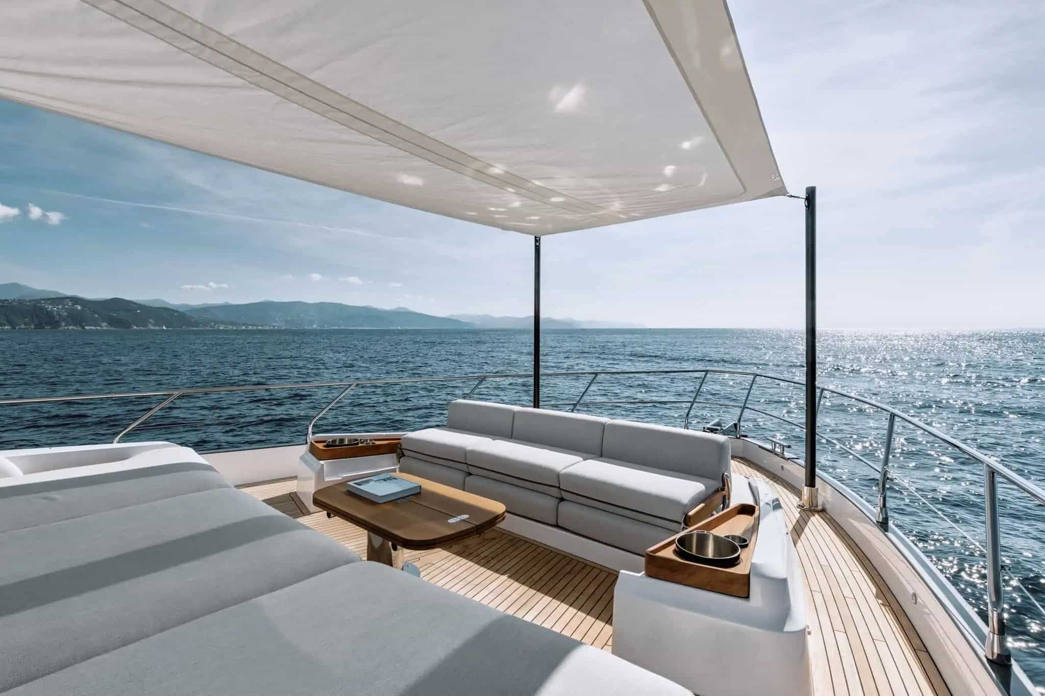 Azimut Fly 68 bow lounge shaded by bimini — shipyard photo