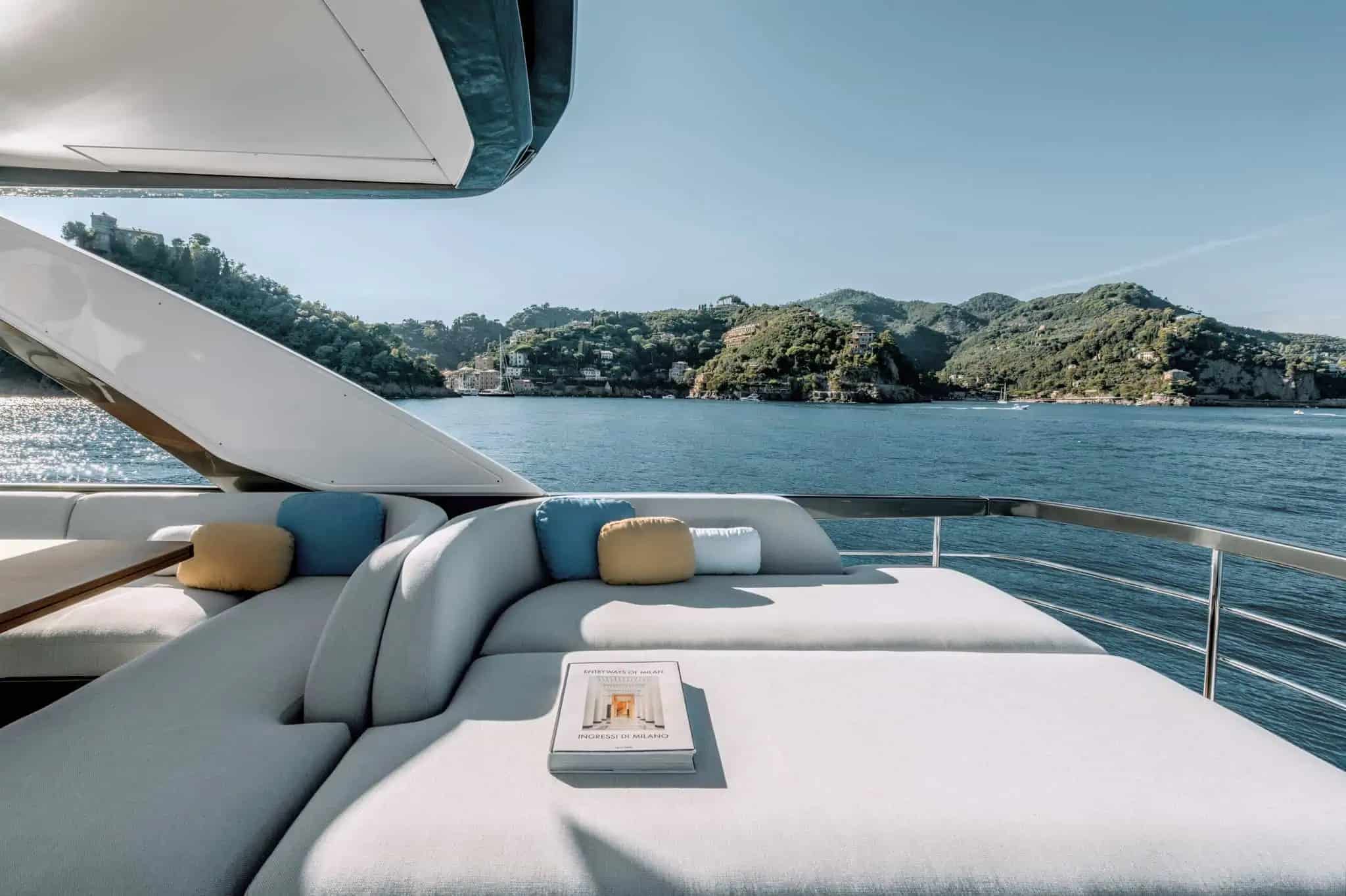 Azimut Fly 68 flybridge sunpad lounge underway — shipyard photo