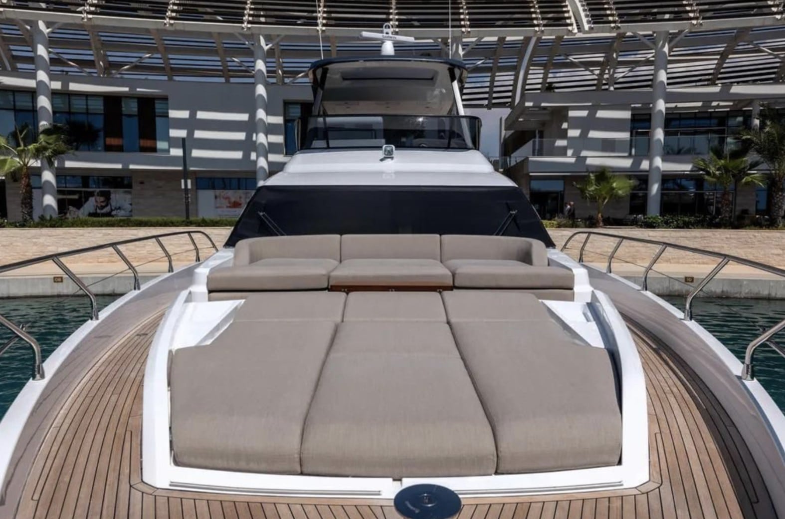 Azimut Fly 68 foredeck sunpad facing the marina — press photo