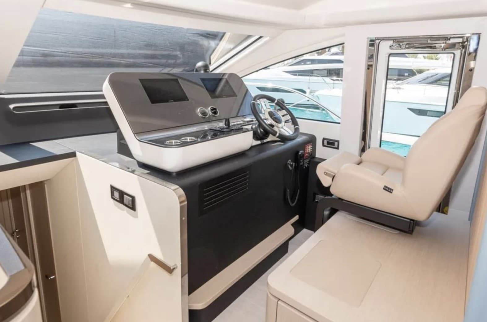 Azimut Fly 68 lower helm with navigation screens — press photo
