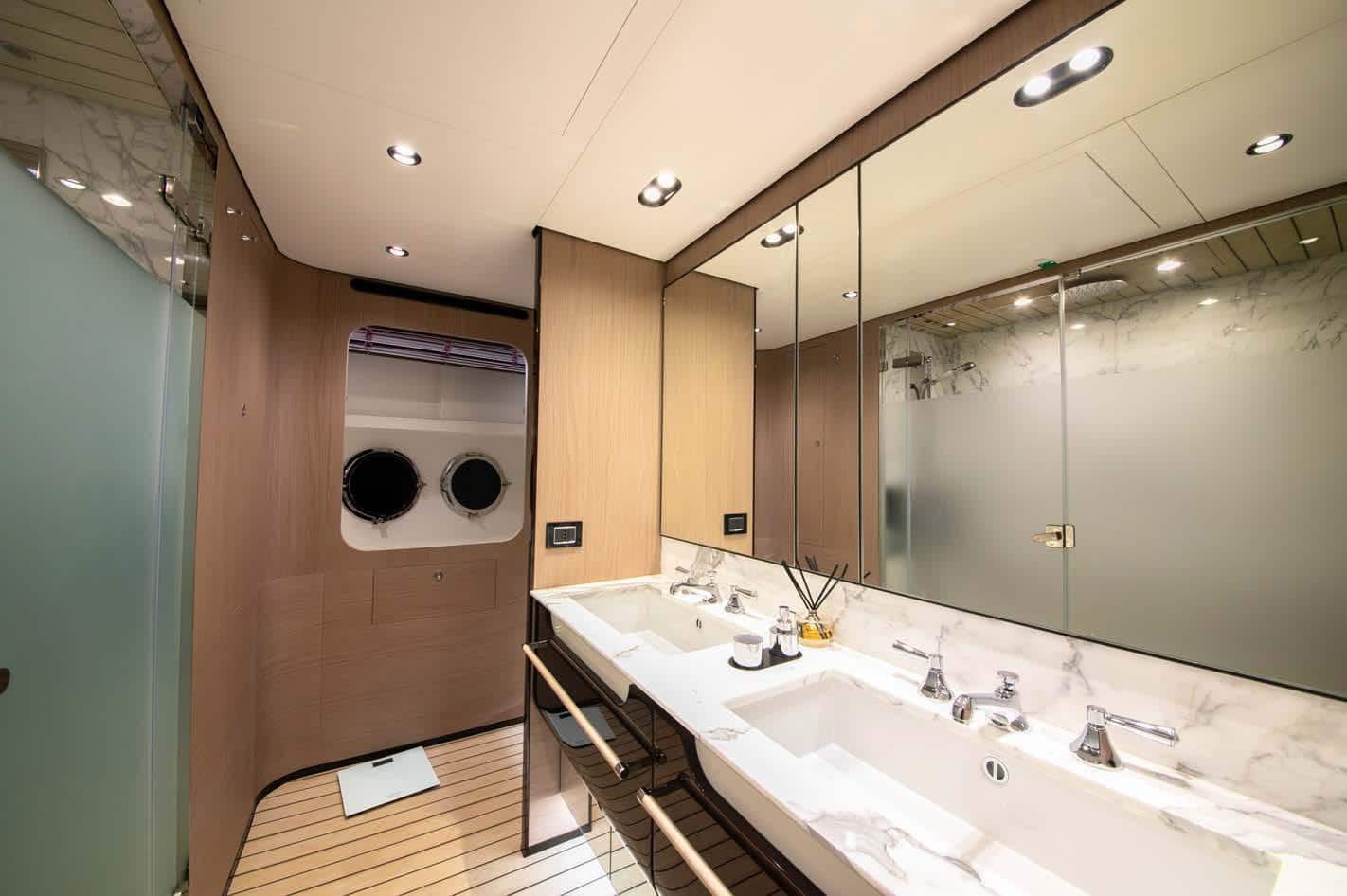 Azimut Grande 27M owner's bathroom with double vanity, broker photo
