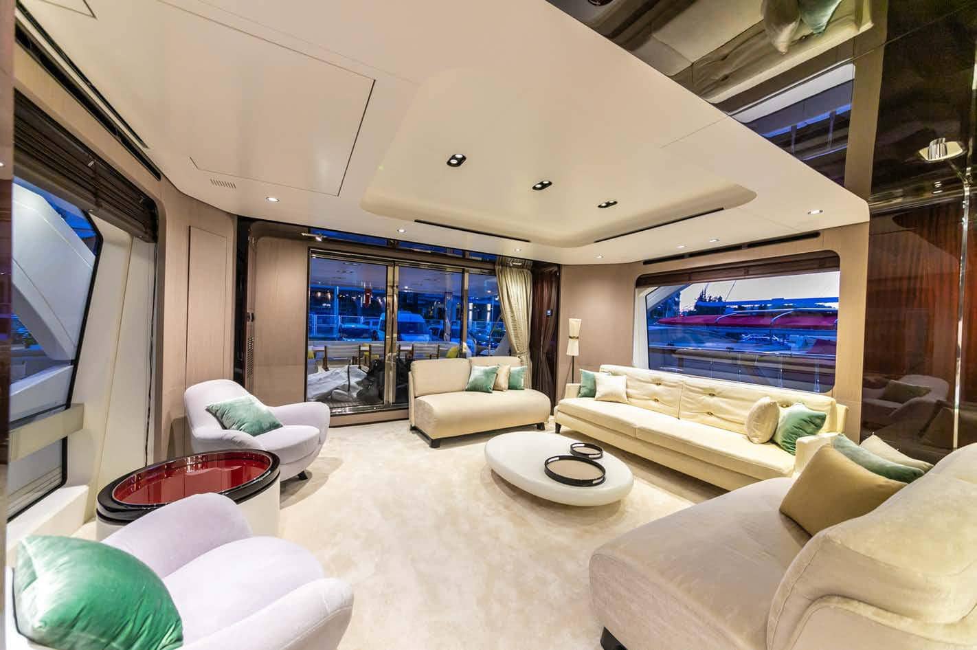 Azimut Grande 27M salon looking aft with panoramic windows, broker photo