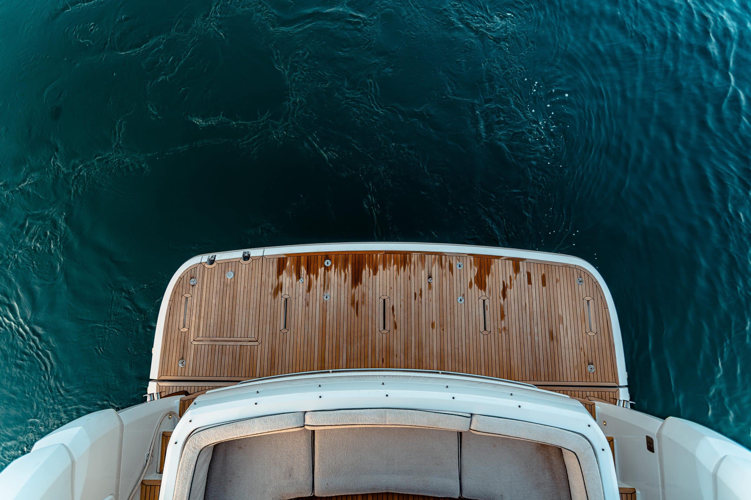 Azimut Magellano 66 aerial view of the teak foredeck at anchor