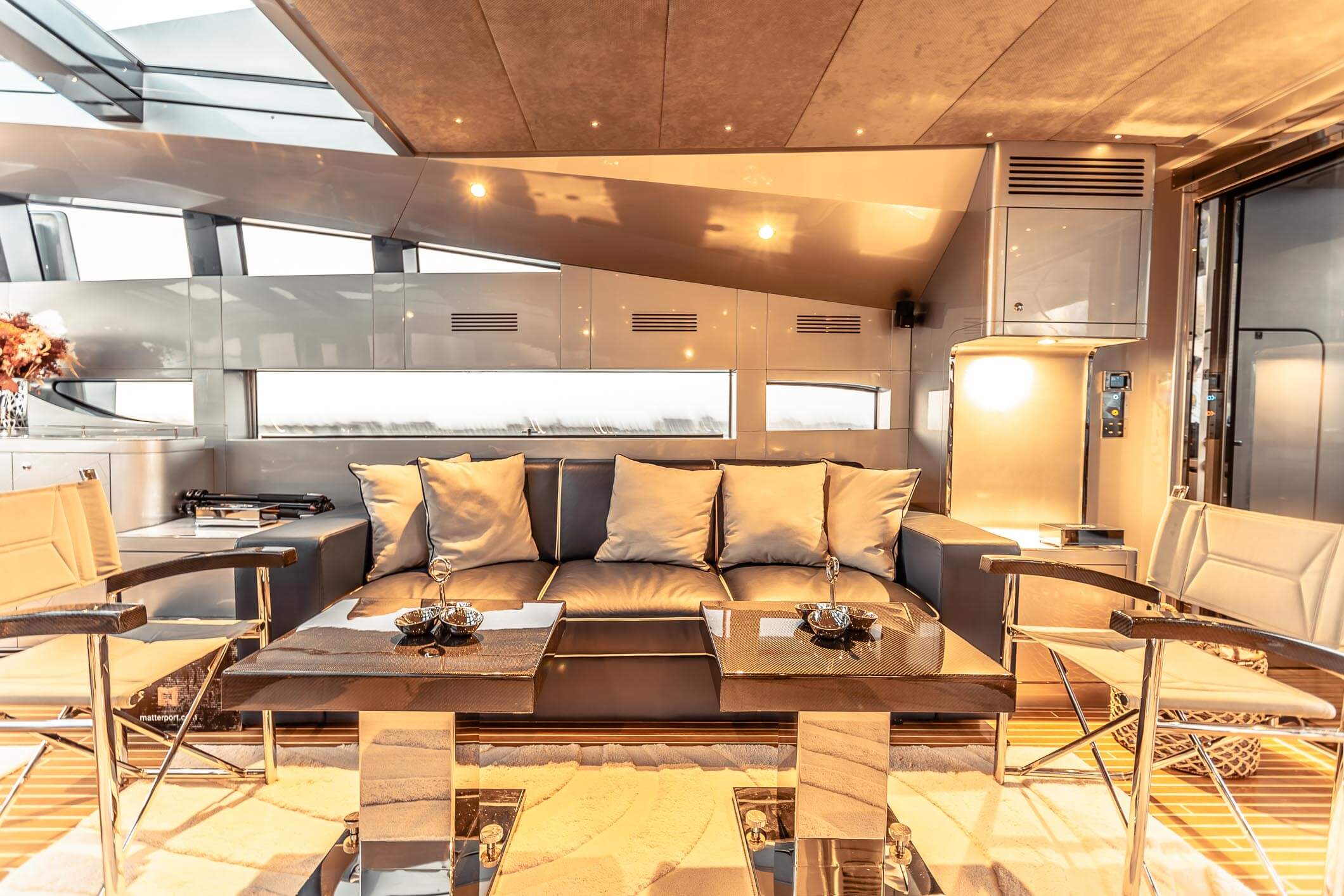 Baglietto 105 HT saloon seating with coffee tables and lamps