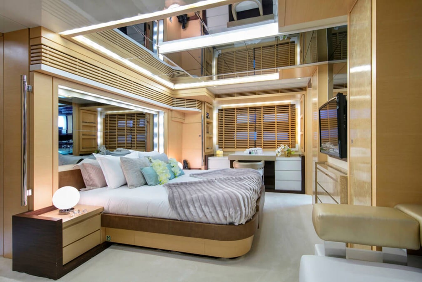 Baia 100 master cabin with television and wood panelling