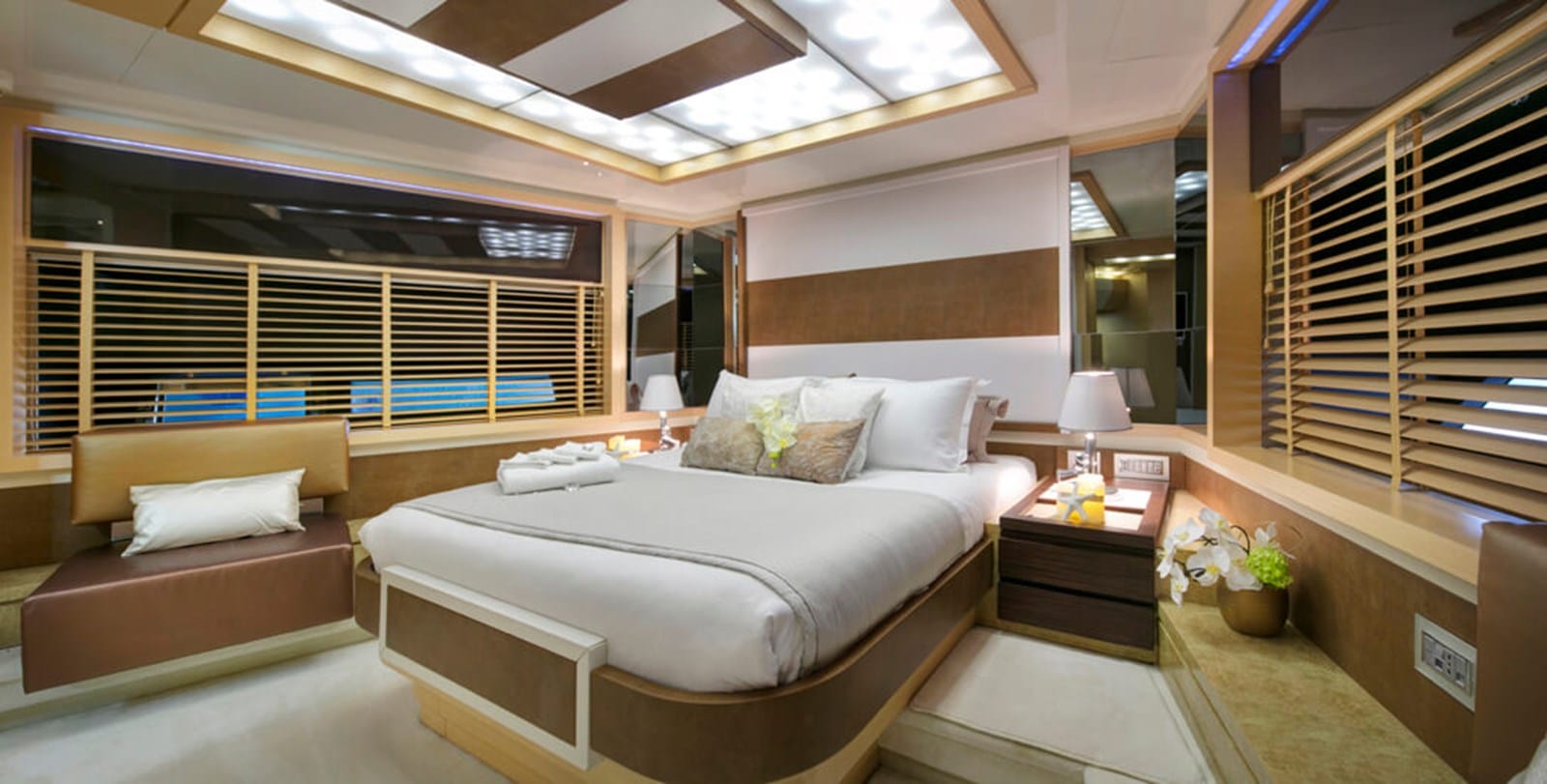 Baia 100 master cabin with skylight and warm wood joinery