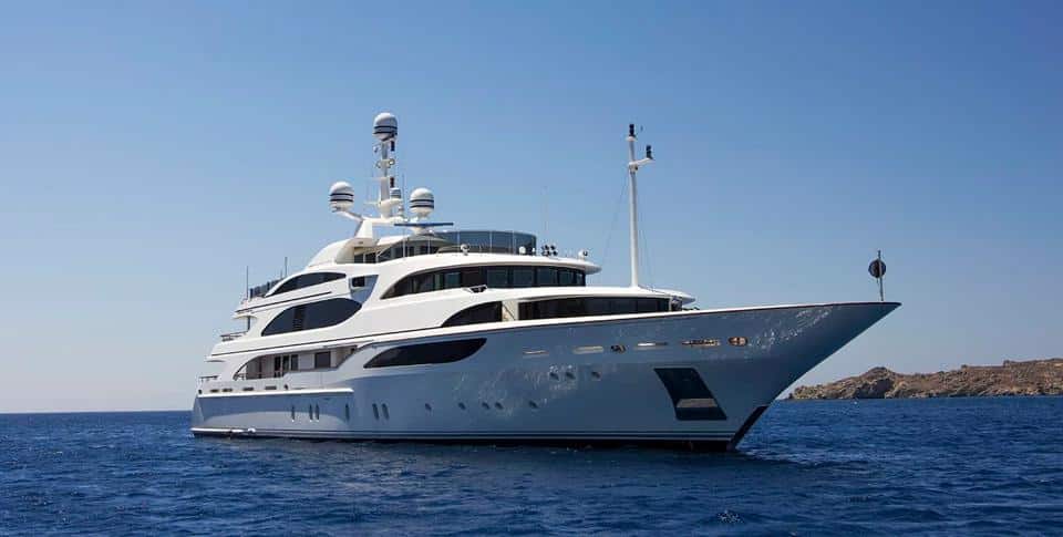 Benetti 56M bow three-quarter view at anchor off the coast