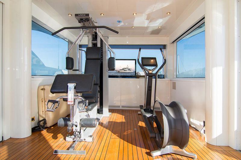 Benetti 56M gym with elliptical trainer, weights and sea view