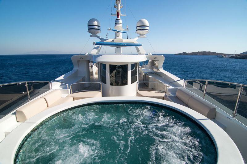 Benetti 56M sundeck jacuzzi bubbling with bow and mast ahead