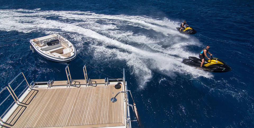 Benetti 56M swim platform lowered with tender and jet skis