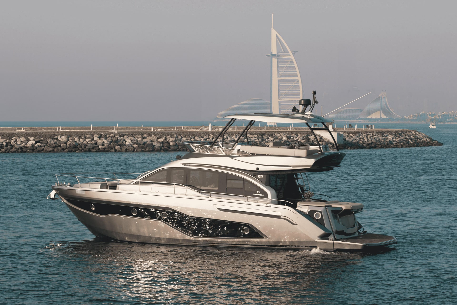 Cranchi 52 Evoluzione profile at anchor with Burj Al Arab behind