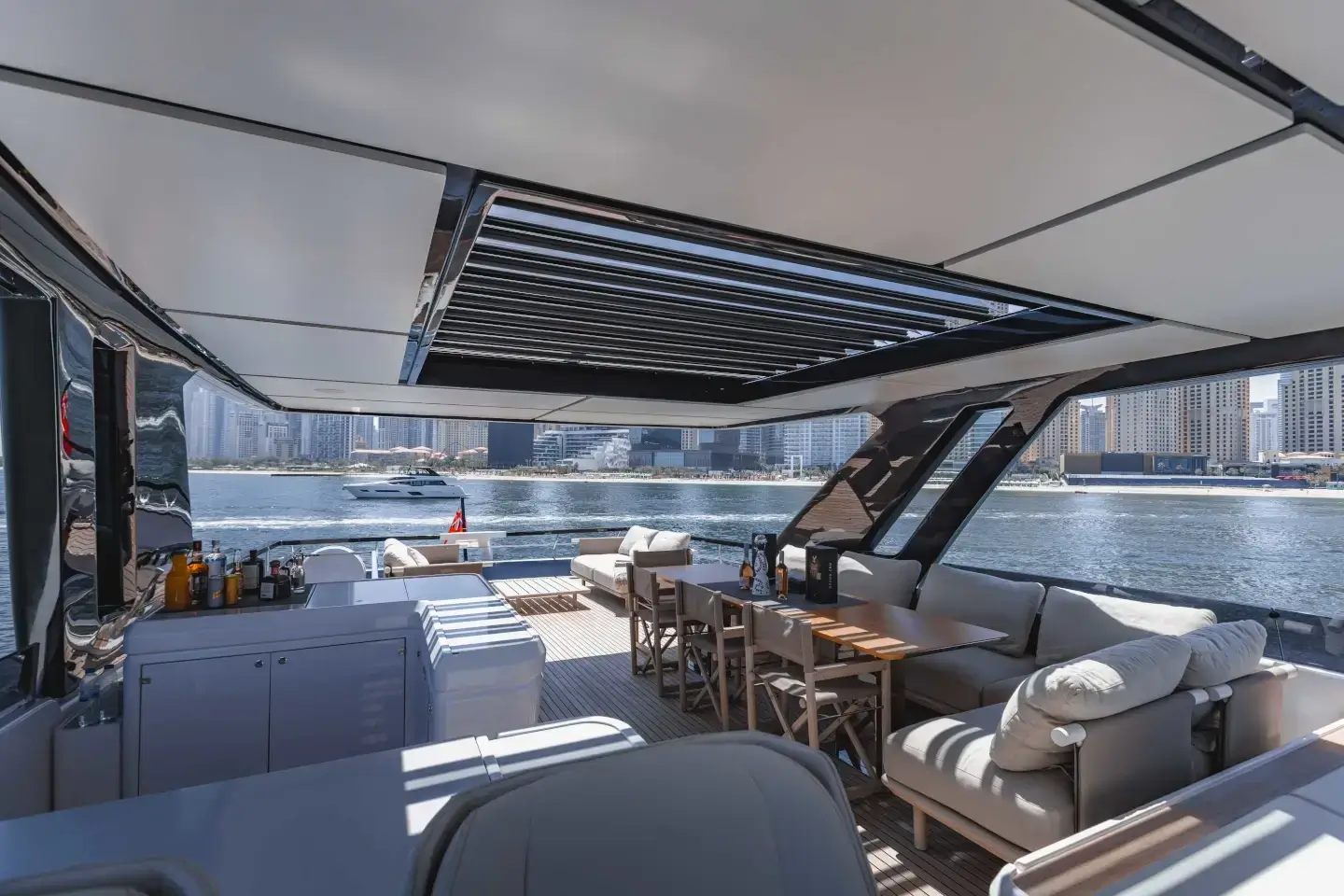 Ferretti 860 flybridge bar and dining with skyline views