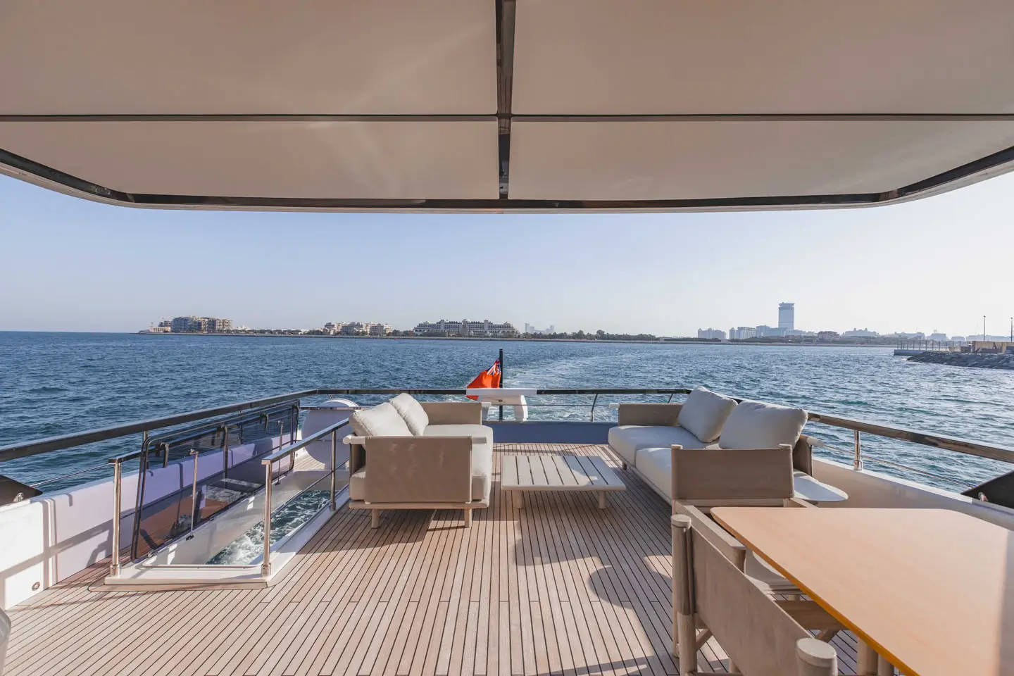 Open-air flybridge lounge aboard the Ferretti 860 at sea