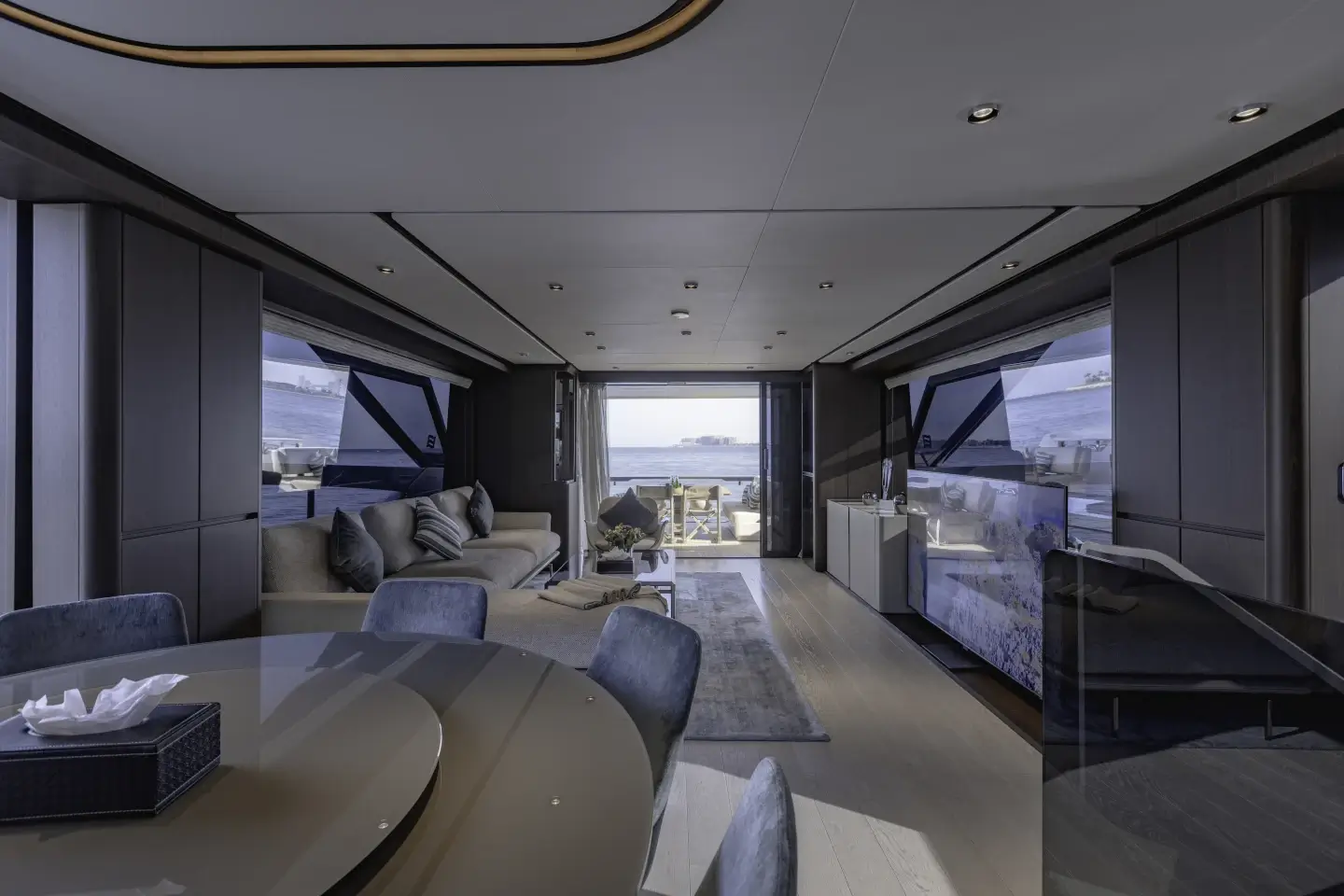 Ferretti 860 main saloon in deep tones, view to the cockpit