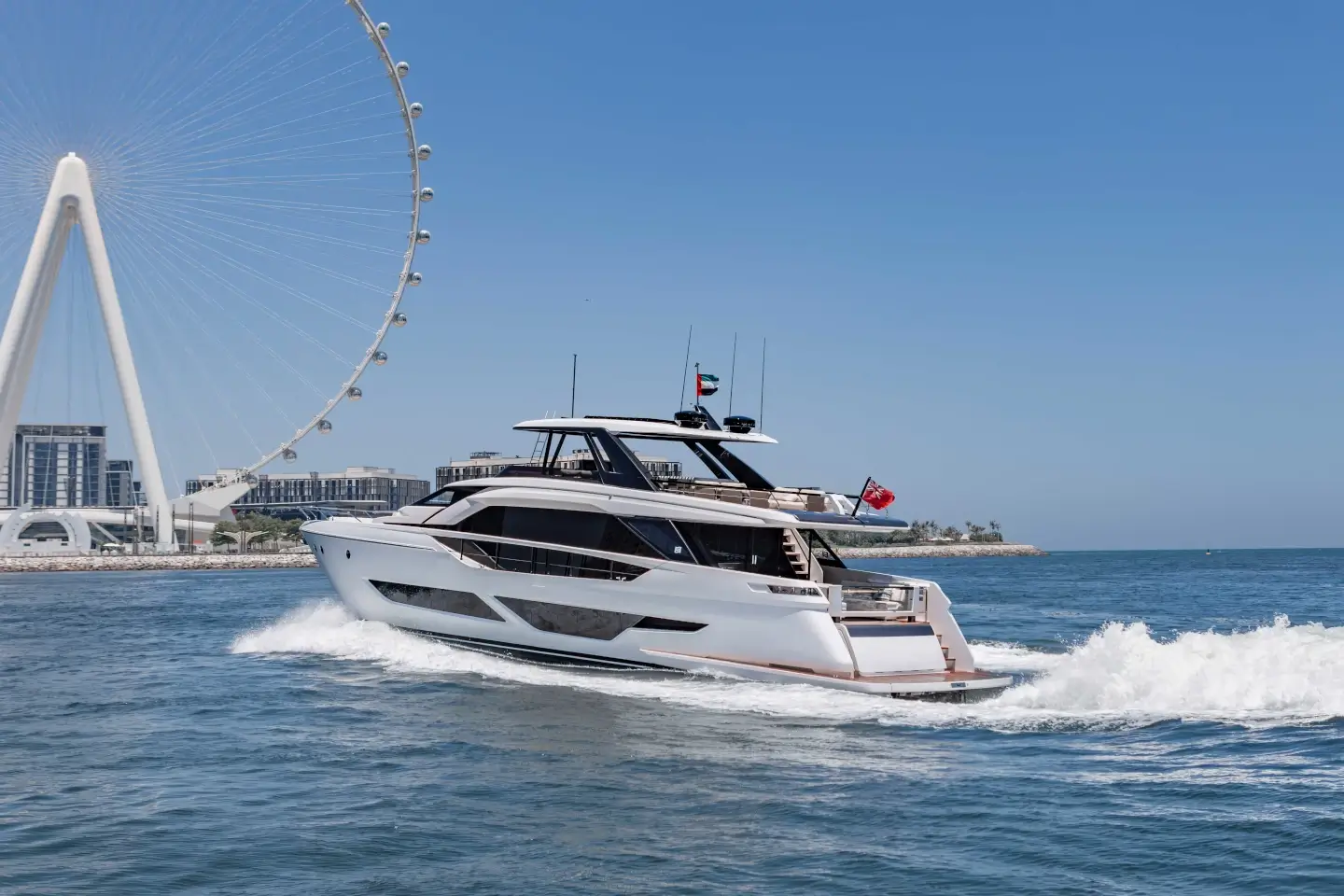 Ferretti 860 cruising past Ain Dubai and Bluewaters Island