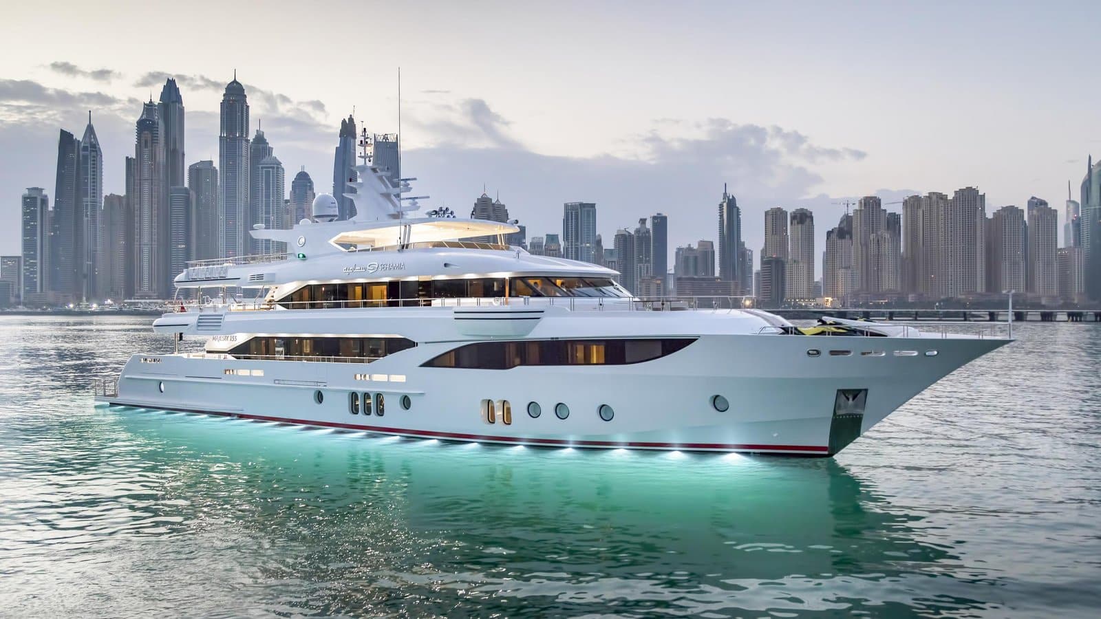 Majesty 155 superyacht exterior profile cruising past the Dubai Marina skyline