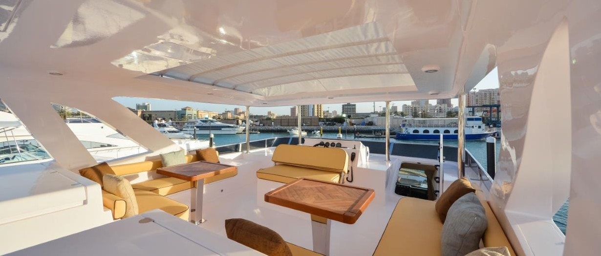 Nomad 65 flybridge lounge and helm station — shipyard photo