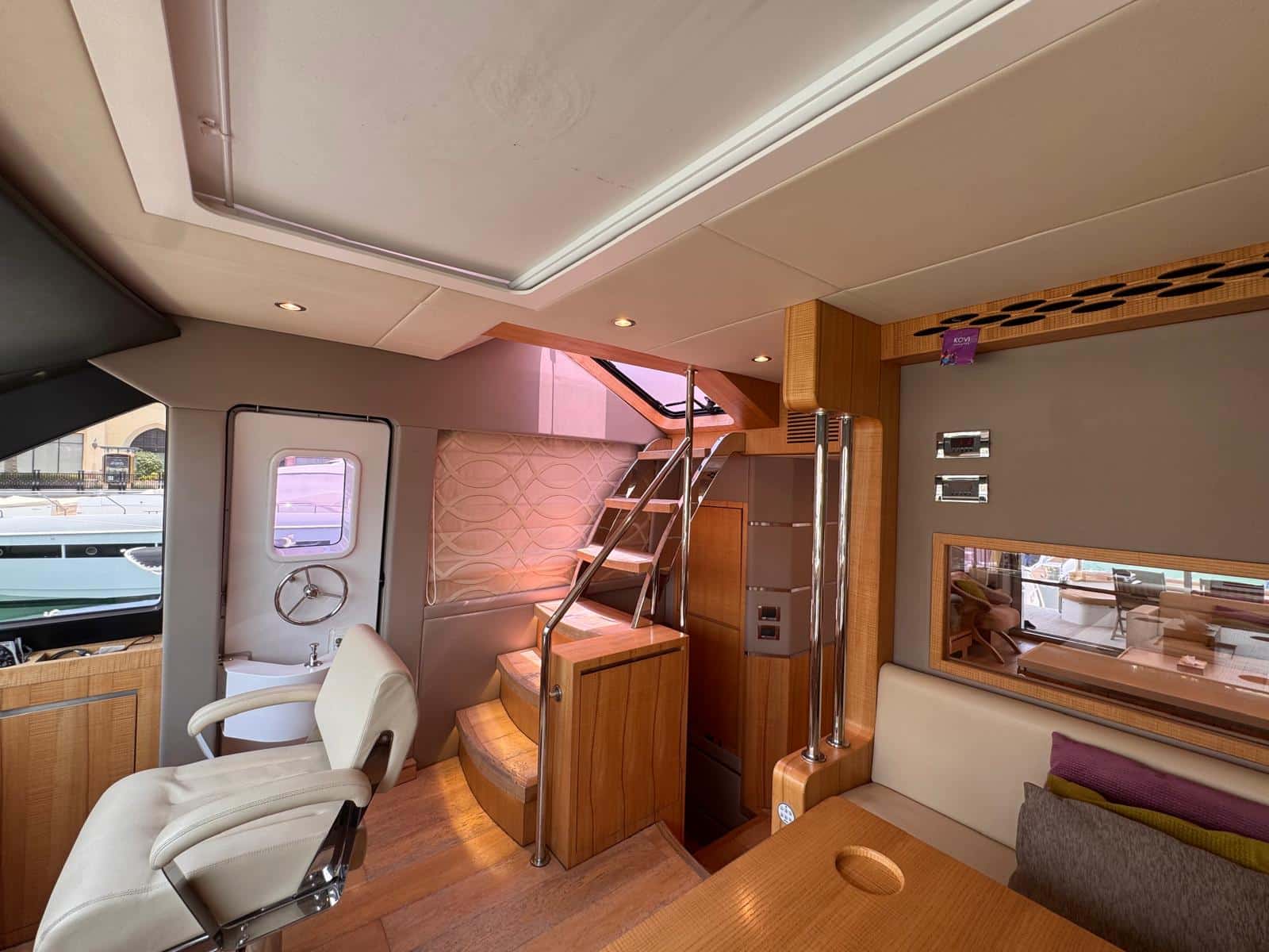 Nomad 65 flybridge stairs leading down to the aft cockpit deck