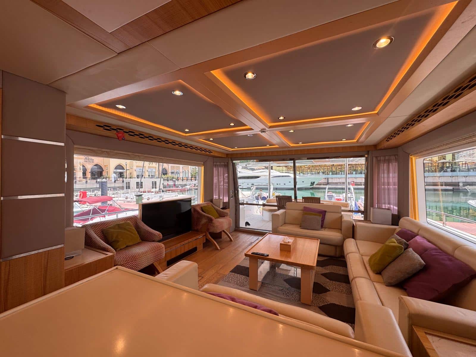 Nomad 65 saloon with aft views over The Pearl-Qatar marina