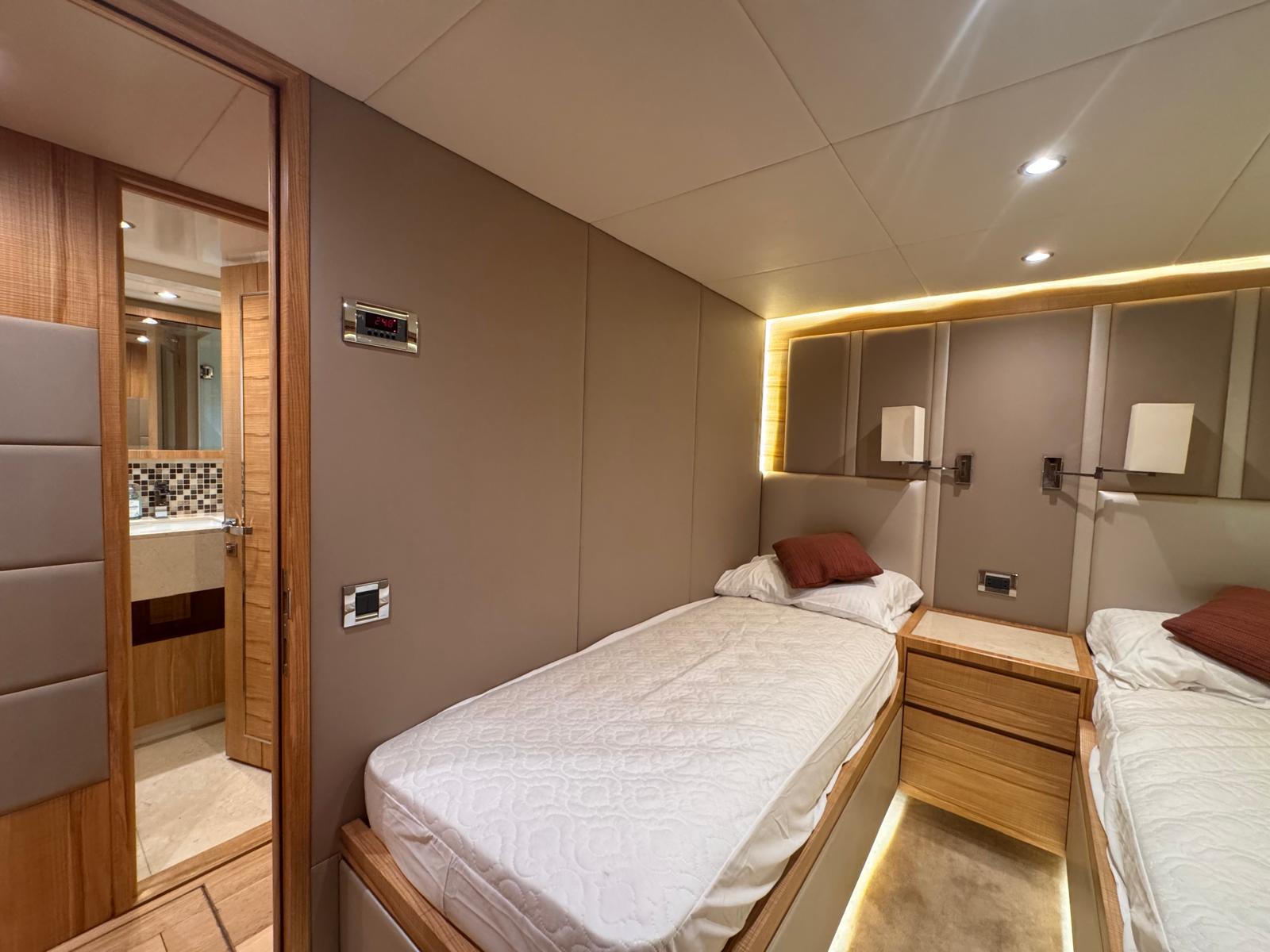 Nomad 65 twin guest cabin with two single berths and ensuite