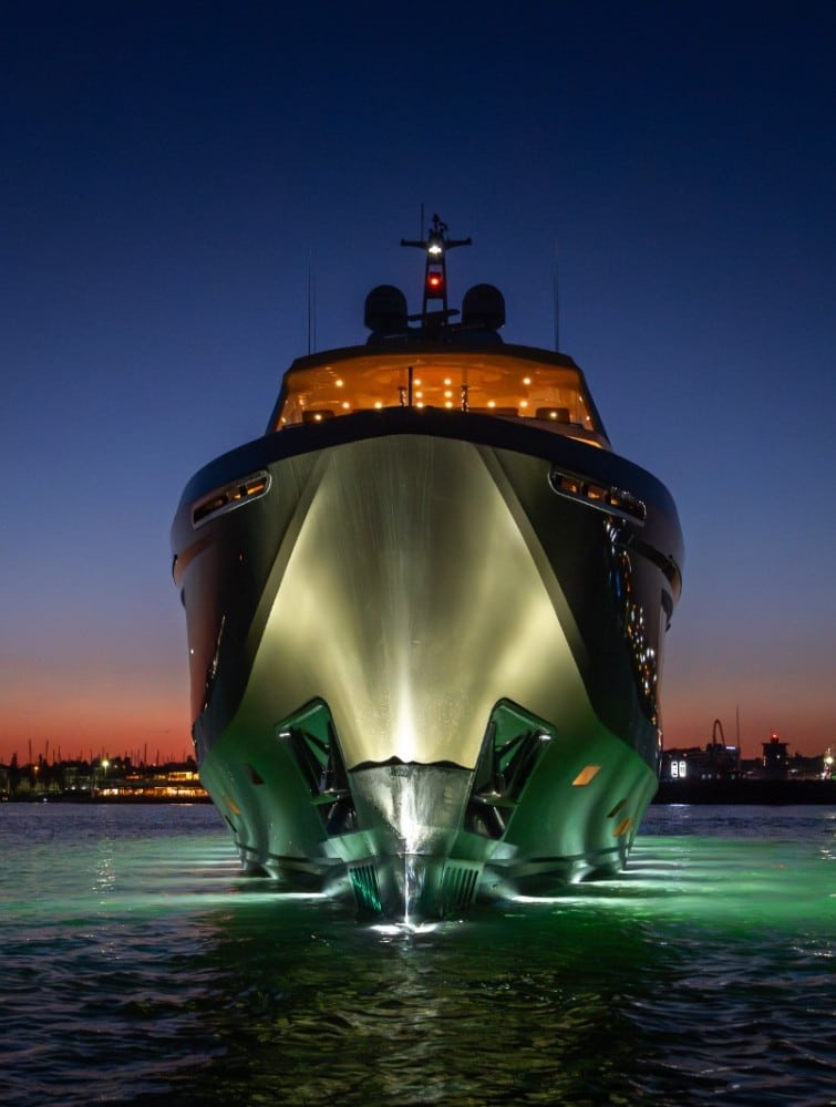 Numarine 40MXP bow view at dusk with lights on — shipyard photo