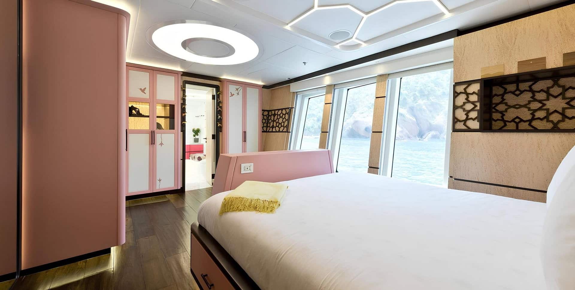 SuperSport 48 owner's cabin with king berth and pink accents