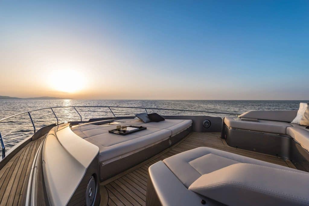 Pershing 8X foredeck sunpads at sunset — shipyard photo