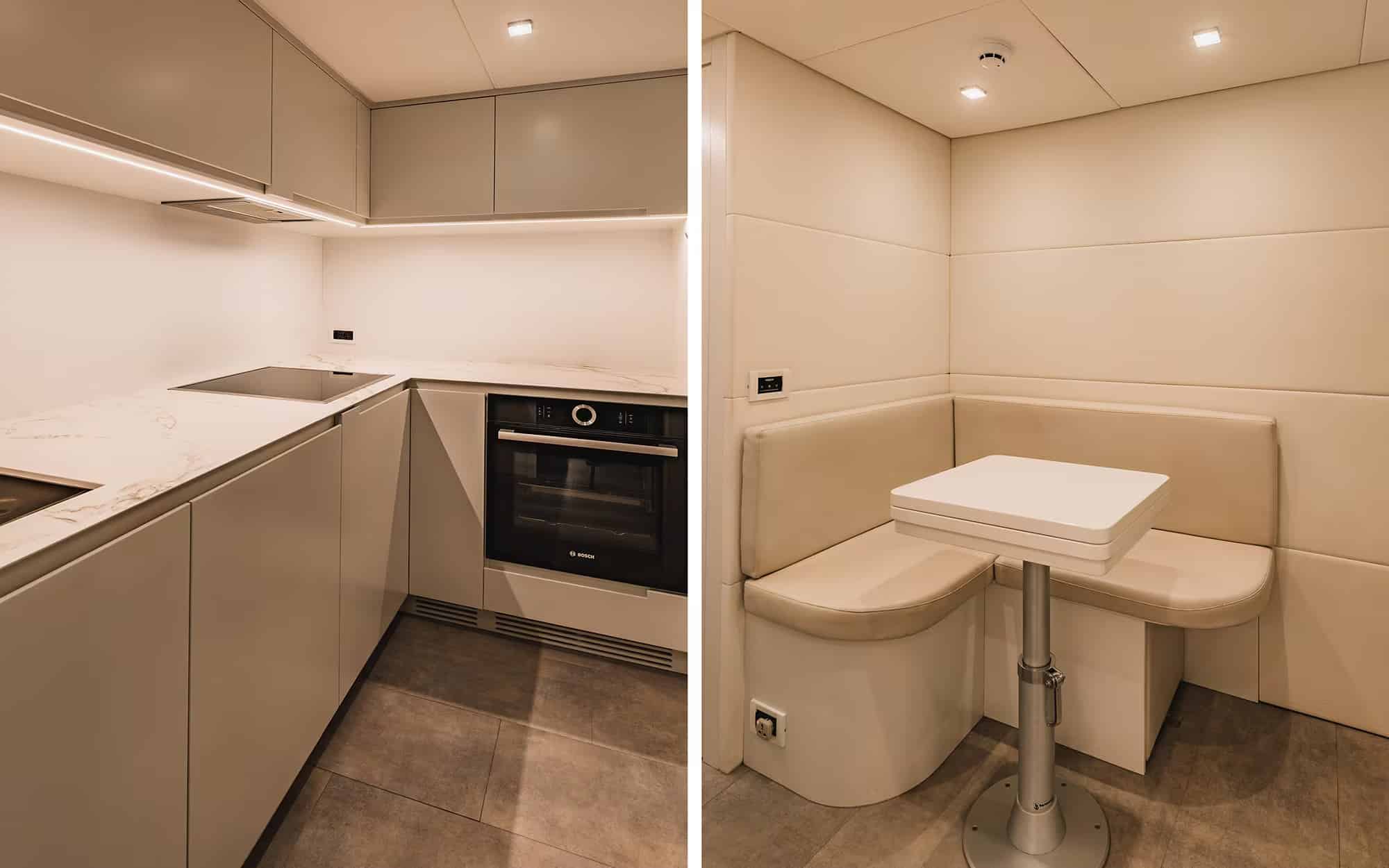 Pershing 8X lower-deck galley and crew dinette in pale joinery