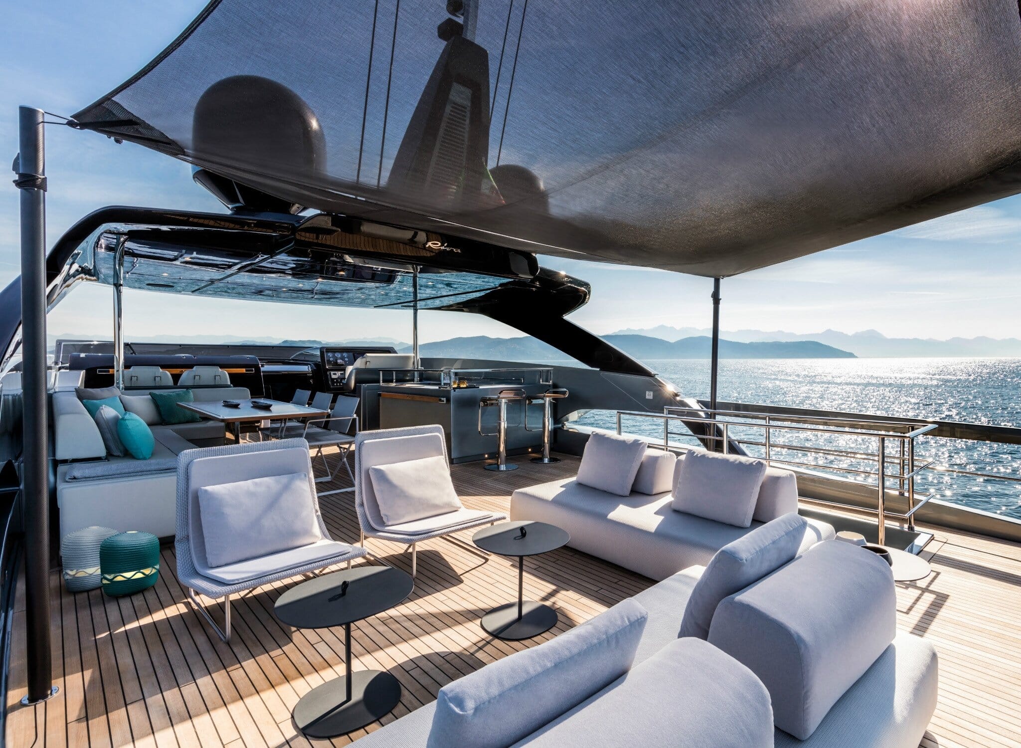 Riva 100 Corsaro flybridge lounge with bar, dining and helm views