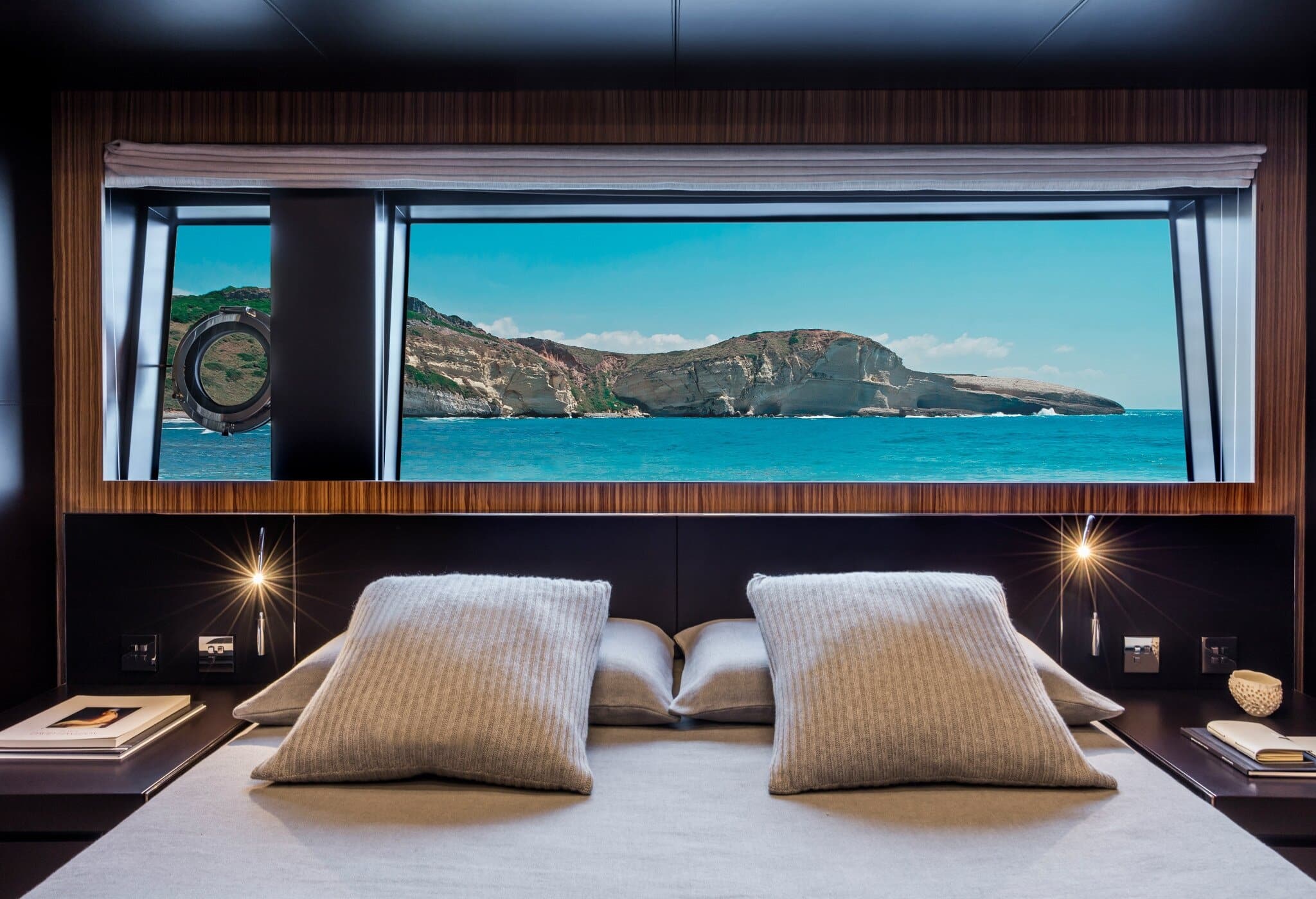 Riva 100 Corsaro guest cabin with panoramic hull-side window view