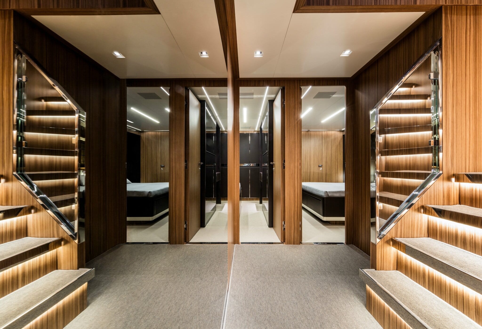 Riva 100 Corsaro lower-deck lobby with illuminated guest staircases
