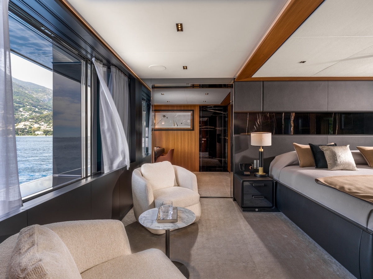 Riva 54Metri owner suite sitting area and hull window, broker photo