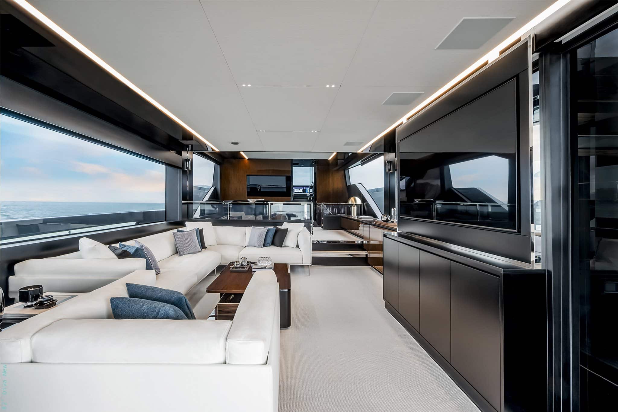 Riva 82 Diva main saloon with white sofas and dark gloss joinery