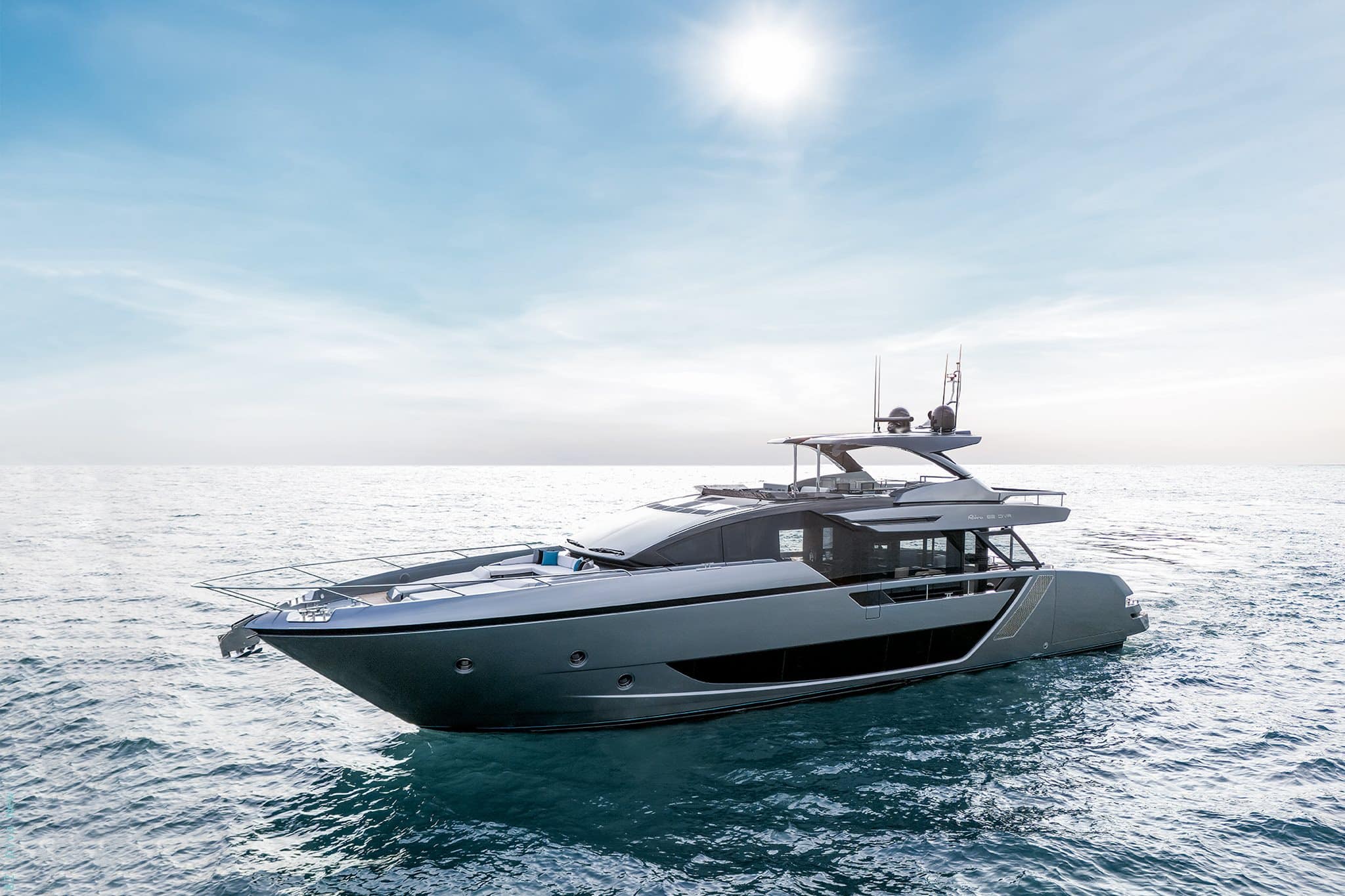 Riva 82 Diva profile underway in bright sun, grey hull at sea