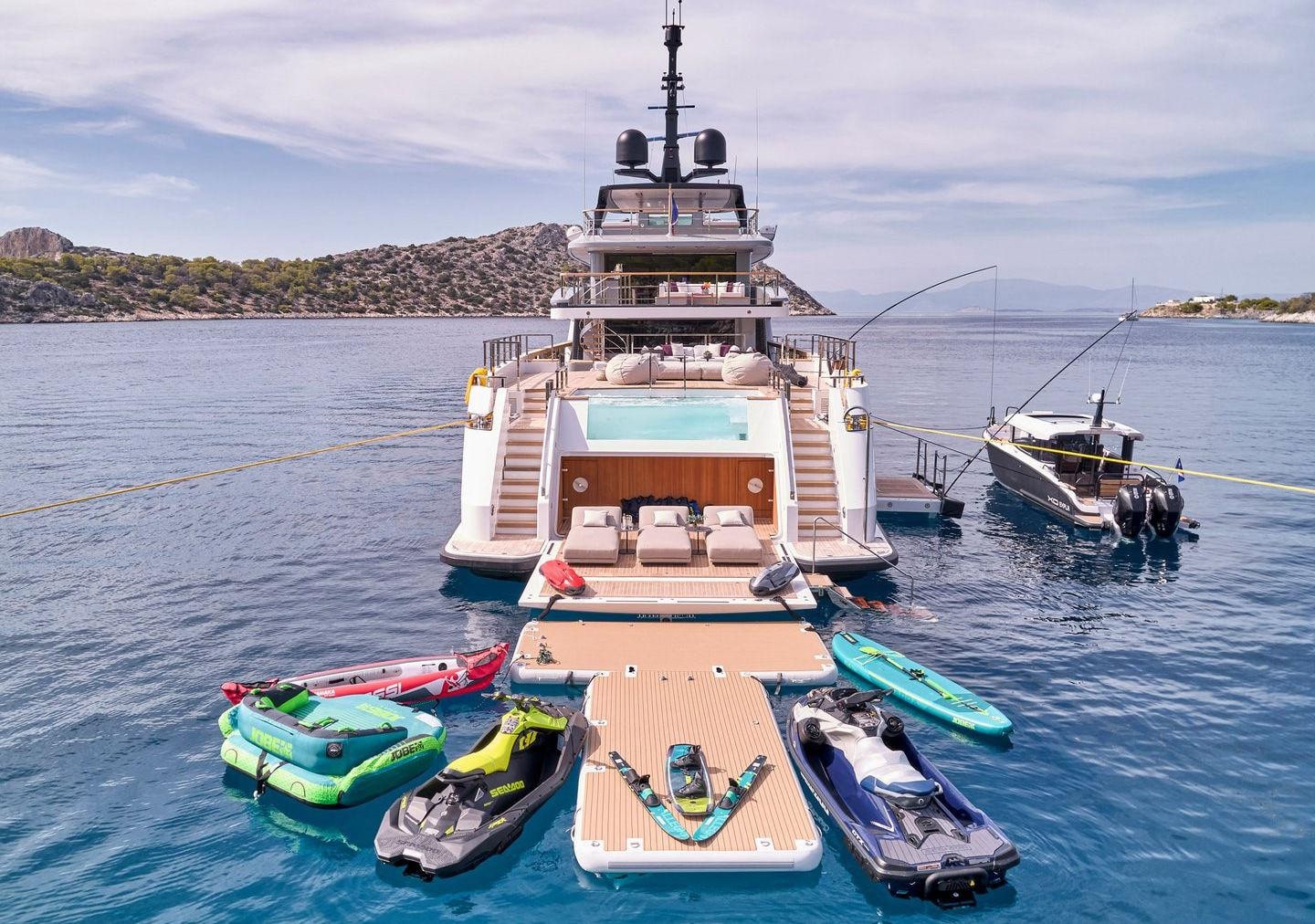 Sanlorenzo 500EXP stern with pool, beach club and water toys, broker photo