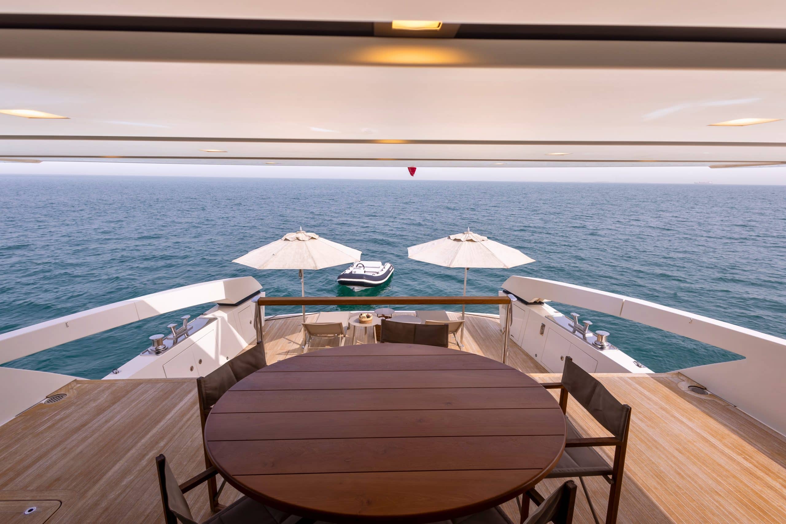 SanLorenzo SX88 aft deck dining table shaded above the beach club